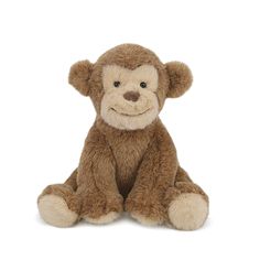 a brown stuffed monkey sitting on top of a white floor