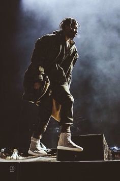 a man standing on top of a stage