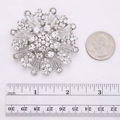 "Dazzling crystal silver brooch bridal embellishment, which can be used for your DIY project - glam wedding bridal brooch bouquet, ring pillow, invitations, garter, frame and cake decorations, event decor, crafts, scrap booking and much more! Size: 2\"H x 2\"W Stone color: Crystal clear Metal: Silver plated This crystal clear broach can be ordered with pin in the back to add to wedding gown or dress sash, to wire into brooch bouquet, or any number of other craft projects; or without the pin as a Bouquet Ring, Wedding Brooches, Bridal Brooch, Bridal Brooch Bouquet, Dress Sash, Brooch Bouquet, Wedding Brooch, Ring Pillow, Brooch Bouquets