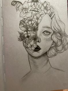 a drawing of a woman with flowers in her hair