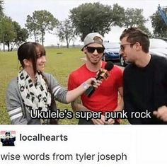 two men and a woman standing next to each other in front of a car with the words ukulele's super punk rock written on it