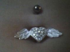 an angel brooch with crystal wings on it