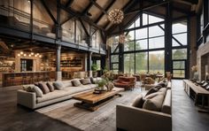 a large open living room with high ceilings and lots of windows on the side of it