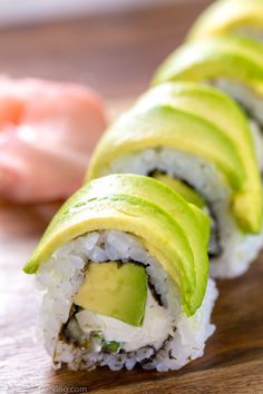 sushi rolls with avocado cut in half