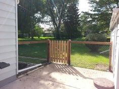 the back yard is fenced off with wood