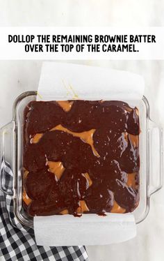 a brownie in a glass baking dish with caramel toppings on top and the words dolpp the remaining brownie batter over the top of the caramel