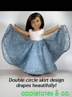 the doll is wearing a blue dress