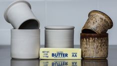 several different types of pottery sitting on a table