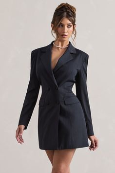 Take business casual to new heights with our premium blazer dress, State Of Mind. Crafted in a deep navy hue of our premium pinstripe, this tailored mini features subtle shoulder padding, peak lapels and a self-tie back for a cinched custom fit. For a sophisticated ensemble, pair yours with a simple pearl necklace and tousled bun.  Features - Premium pinstripe- Tailored fit - Peak lapels- Shoulder padding- Double breasted- Self-tie back- Mini length Sizing & Fit Model is 5'7 and wears UK size 8 / US size 4Product Information Designed exclusively by Club L London Lined with some stretch Premium woven fabric in Navy Pinstripe (67% Polyester, 30% Viscose, 3% Elastane)SKU: CL132312015 Pinstripe Dress Outfit, Pinstripe Blazer Outfit, Blazer Dress Outfits, Simple Pearl Necklace, Club L London, Blazer Mini Dress, Simple Pearl, Blazer Set, Blazer Designs