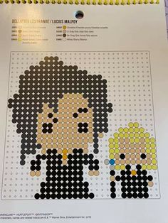 a cross stitch pattern with two people on it