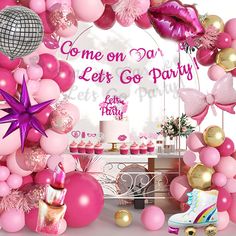 pink and gold party decorations with balloons, streamers, stars, and confetti