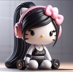 a hello kitty figurine sitting on the ground