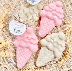 three ice cream cones with tags on them