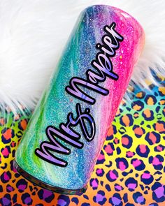 a colorful can with the words make me happy on it next to a white furry animal print background