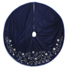 a blue and white round cloth with snowflakes on it