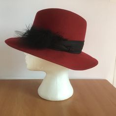 Vintage Red Wool Felt Fedora Hat. Beautiful Candy apple red with a stylish black band with a feather. The hat will fit up to 21 1/2 inch head size, 3 inch brim, 5 inch tall crown. Excellent condition. Please see photos. 2023-11 Tall Crown, Felt Fedora, Candy Apple Red, Apple Red, Candy Apple, Red Wool, Fedora Hat, Wool Felt, Fedora