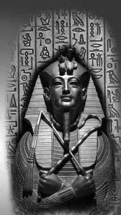 an egyptian statue with two crossed swords in front of the face of pharaoh tutane