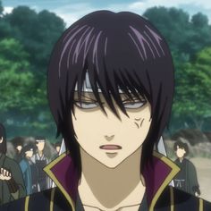 an anime character with black hair and purple eyes looking at the camera while others look on