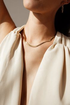 Centauri's Herringbone Snake Chain Necklace is a must-have for everyday wear. Its herringbone chain gives it a unique look that's still subtle enough for any occasion. It's also water resistant and tarnish resistant, making it a reliable accessory. Enjoy a stylish look that won't let you down. MATERIAL: 18k Gold plated, Stainless steel SIZE: 16" or 18" (Available in silver - Check out our Silver Collection!) Water resistant, tarnish resistant, hypoallergenic, & nickel/lead free. Everyday Gold Chain Herringbone Necklace, Dainty Herringbone Necklace With Box Chain, Dainty Everyday Herringbone Necklace With Box Chain, Dainty Gold Chain Herringbone Necklace For Everyday, Everyday Gold Snake Chain Necklace, Dainty Herringbone Necklace With Gold Chain For Everyday, Everyday Dainty Herringbone Necklace With Gold Chain, Minimalist Snake Chain Herringbone Necklace For Everyday, Classic Everyday Snake Chain Necklace With Clavicle Chain