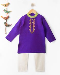 This unique in unique, different from the rest, purple colored kurta pajama offers stunning Beadwork (hand work) Embroidery with a brocade collar and fabric buttons. The pairing up of comfy pajama's will make your lil-one enjoy all the festivities around him. The colorful kurta pajama is the ideal choice for your lil one this festive season. SIZING TIP : * Please review the size chart for each outfit before making your size selection. more specifically look at the chest and length * If your child currently wears different sizes for top and bottom, please go with the smaller size of the two while picking the outfit FABRIC: Cotton Silk (Kurta), Cotton (Pajama) WHATS INCLUDED: Kurta and Pajama CARE: Dry Clean Only Embroidered Purple Sets For Eid, Purple Long Sleeve Traditional Wear With Embroidered Border, Purple Kurta With Embroidered Border For Eid, Purple Embroidered Long Sleeve Kurta, Bollywood Style Purple Kurta With Long Sleeves, Purple Long Sleeve Bollywood Kurta, Purple Straight Kurta Set For Diwali, Purple Kurta With Zari Work For Festivals, Festive Purple Kurta With Embroidered Border