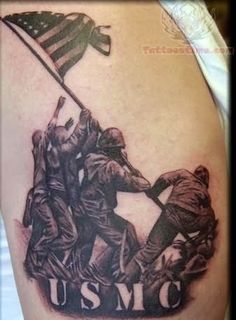 a tattoo with the words usmc on it and two men holding an american flag