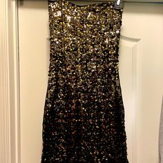 Beautiful Gold And Black Sequin Mini Dress. Sweetheart Neckline. Strapless Dress. Gold Zipper Down Back. Perfect For Nye. Brand New Just Tried On And Took Tag Off. Size 6. You Will Definitely Be A Statement With This Dress. H&m Fitted Mini Dress For Cocktail, Fitted H&m Mini Dress For Cocktail, H&m Knee-length Dress For Date Night, H&m Black Sleeveless Dress, H&m Sequin Dresses For Party Season, H&m Sequined Dresses For Night Out, Elegant Sequined H&m Dresses, Fitted Sequin Dresses From H&m, H&m Evening Mini Dress