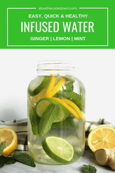 a mason jar filled with lemon and mint infused water next to sliced lemons, ginger, and mint