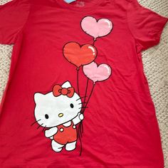 Hello Kitty Nwt Short Sleeve Shirt Size Large. The Color Is A Mix Of Red And Pink. This Short Sleeve Shirt Is So Cute!!! Thanks For Looking. Ships From Atlanta Smoke And Pet Free Home Hello Kitty Fun Hello Kitty Short Sleeve Tops, Playful Hello Kitty Short Sleeve Tops, Cute Red Crew Neck Top, Red Cartoon Print Top For Spring, Red Hello Kitty Print Crew Neck Top, Casual Red Hello Kitty Top, Red Crew Neck Top With Hello Kitty Print, Cute Red Fitted T-shirt, Cute Fitted Red T-shirt