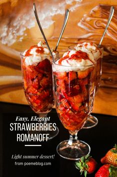 two glasses filled with strawberries on top of a table