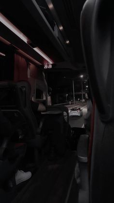 the interior of a bus with no people in it at night or on the street