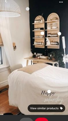 a room with a bed, desk and shelves on the wall that have bottles in them