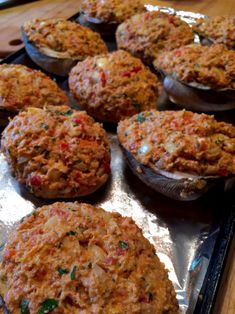 baked stuffed mushrooms on a baking sheet ready to be eaten