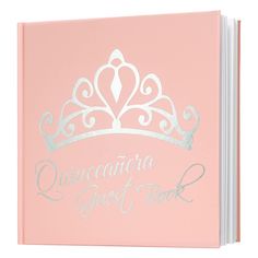 a pink notebook with a tiara on top and the words quincecacia guest book