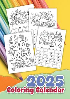 three coloring calendars with the words happy new year on them and two colored pencils in