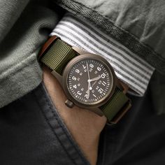 38 mm stainless steel case, three hand display, dark dial with light-colored numerals, triangular indexes with old radium color Super-LumiNova®, durable NATO strap: The new Khaki Field Mechanical is a faithful recreation of its original 1960s forebear and is true to Hamilton’s military heritage. The original soldier’s watch now features Hamilton’s unique ‘Earth’ colored PVD case coating. WATCH Features Reference: H69449961 Caliber H-50 Collectio: Khaki Field Movement: Mechanical Case size: 38mm Classic Outdoor Watch With Analog Display, Green Analog Watch For Everyday Use, Vintage Brown Watch For Outdoor, Classic Green Watch For Everyday Use, Timeless Brown Watch Accessories For Outdoor, Vintage Watches With Analog Display For Outdoor, Vintage Outdoor Watches With Analog Display, Vintage Outdoor Watch With Analog Display, Classic Brown Outdoor Watch