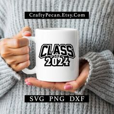 a woman holding a white coffee mug with the words class of 202 printed on it