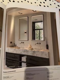 a bathroom with double sinks and mirrors in the middle of it's wall space