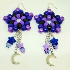 Please See All Details And Photos Before Purchasing: Galaxy Themed Kandi Star Dangle Earrings Perfect For Raves, Festivals, Anime Conventions, Cosplay, Parties Etc. Earrings Are Handmade With Pearl Purple Pony Beads, Purple Pony Beads, Black Pony Beads, Blue Star Beads, Purple Star Beads, Silver Chains, Silver Moon Charms, Elastic String, Jump Rings, Fish Hooks, Rubber Backings. Big Pony Bead Star Is 1.93 X 1.93 Inches (Lxw) First Chain Length Hangs 2.07 In. Long With Charm Second Chain Length H Pony Bead Star, Bead Star, Chains Silver, Pearl Purple, Star Dangle Earrings, Pony Bead Bracelets