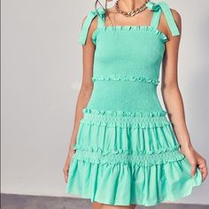 Soft Jade Tie Shoulder Smocked Mini Dress Smocked Ruffle Dress For Casual Wear, Casual Smocked Mini Dress With Ruffles, Fitted Sleeveless Smocked Dress, Green Smocked Dress With Ruffles For Day Out, Fitted Green Sundress With Smocked Bodice, Chic Fitted Smock Sundress, Fitted Smock Sundress Mini Length, Green Fitted Sundress With Smocked Back, Fitted Green Sundress With Smocked Back