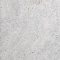 a white marble textured surface with grey veiners