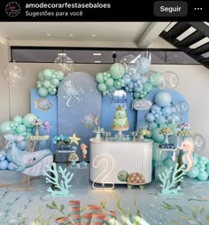 an ocean themed birthday party with balloons and decorations