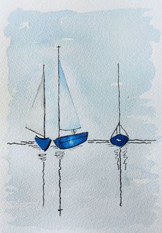 two blue boats floating on top of water