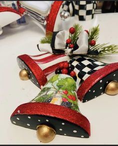 two christmas bells are sitting on the table