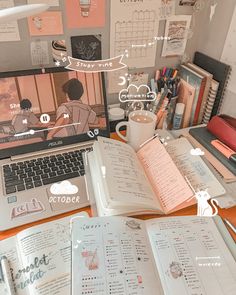 an open book sitting on top of a desk next to a laptop computer