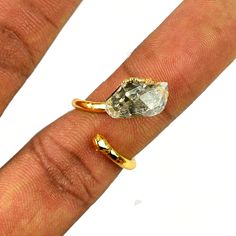 GemFormingStudio D E T A I L S Herkimer Diamond Ring | Electroplated Ring | Copper Ring | Gift For Her | Gift For Women | Ring For Women | Ring For Her | Handmade Ring Gemstone: Free Size Ring Size : All Sizes Available Weight: 2.87 gm Material: Brass Polish: Gold . Contact us for wholesale prices. R I N G S https://www.etsy.com/in-en/shop/GemFormingStudio?section_id=22783374 B E A D S https://www.etsy.com/in-en/shop/GemFormingStudio?section_id=22828835 W A N D S https://www.etsy.com/in-en/shop/ Teardrop Diamond Cut Ring Gift, Adjustable Open Ring With Diamond Cut, Adjustable Diamond Cut Open Ring, Teardrop Diamond Cut Rings For Gifts, Teardrop Diamond Cut Ring As Gift, Diamond Cut Open Crystal Ring Gift, Diamond Cut Open Crystal Ring As Gift, Diamond Silver Ring, Brass Polish