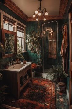 a bathroom with green tiles and plants on the wall, along with a large sink