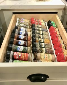 an open drawer with spices and seasonings in it