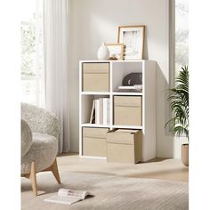 a living room with a white bookcase filled with boxes