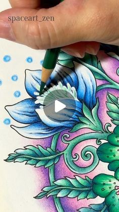 someone is drawing something with colored pencils