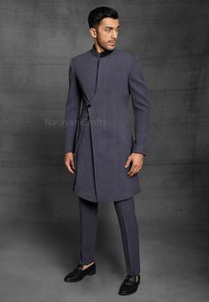 Product Description - The first and most important rule of men's style is you should feel comfortable and confident in your clothes. You will need both these attributes to pull off just about any outfit successfully. A suit that fits increases your confidence and makes you look good. Regardless of how 'classy' or expensive they might be. New Stylish handmade Decent Sherwani for men for wedding and festive occasions.  Stylish New Ethnic Sherwani for men Top Details  -  Color  -  Dark Grey Fabric Fitted Sherwani With Stand Collar For Diwali, Fitted Stand Collar Traditional Wear For Diwali, Fitted Traditional Wear With Stand Collar For Diwali, Fitted Bandhgala With Stand Collar For Diwali, Semi-formal Fitted Kurta With Stand Collar, Traditional Drape Nehru Jacket For Winter, Fitted Sherwani With Stand Collar For Semi-formal Occasions, Fitted Stand Collar Sherwani For Semi-formal Occasions, Semi-formal Fitted Sherwani With Stand Collar